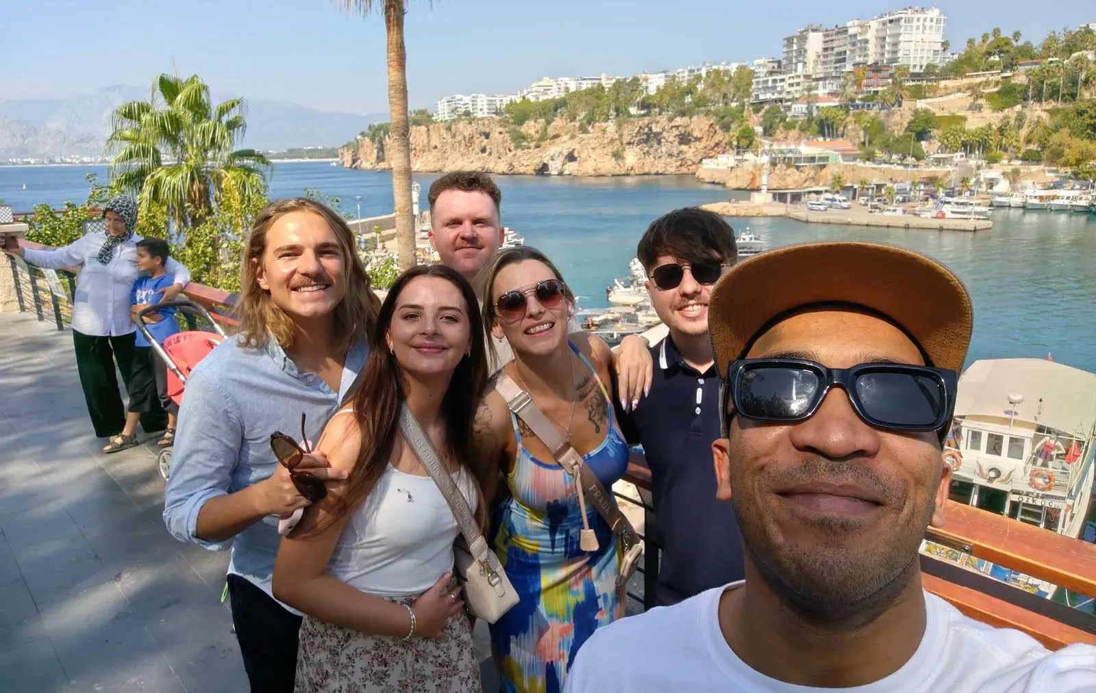 Colleagues together on a harbour walkway in the sun