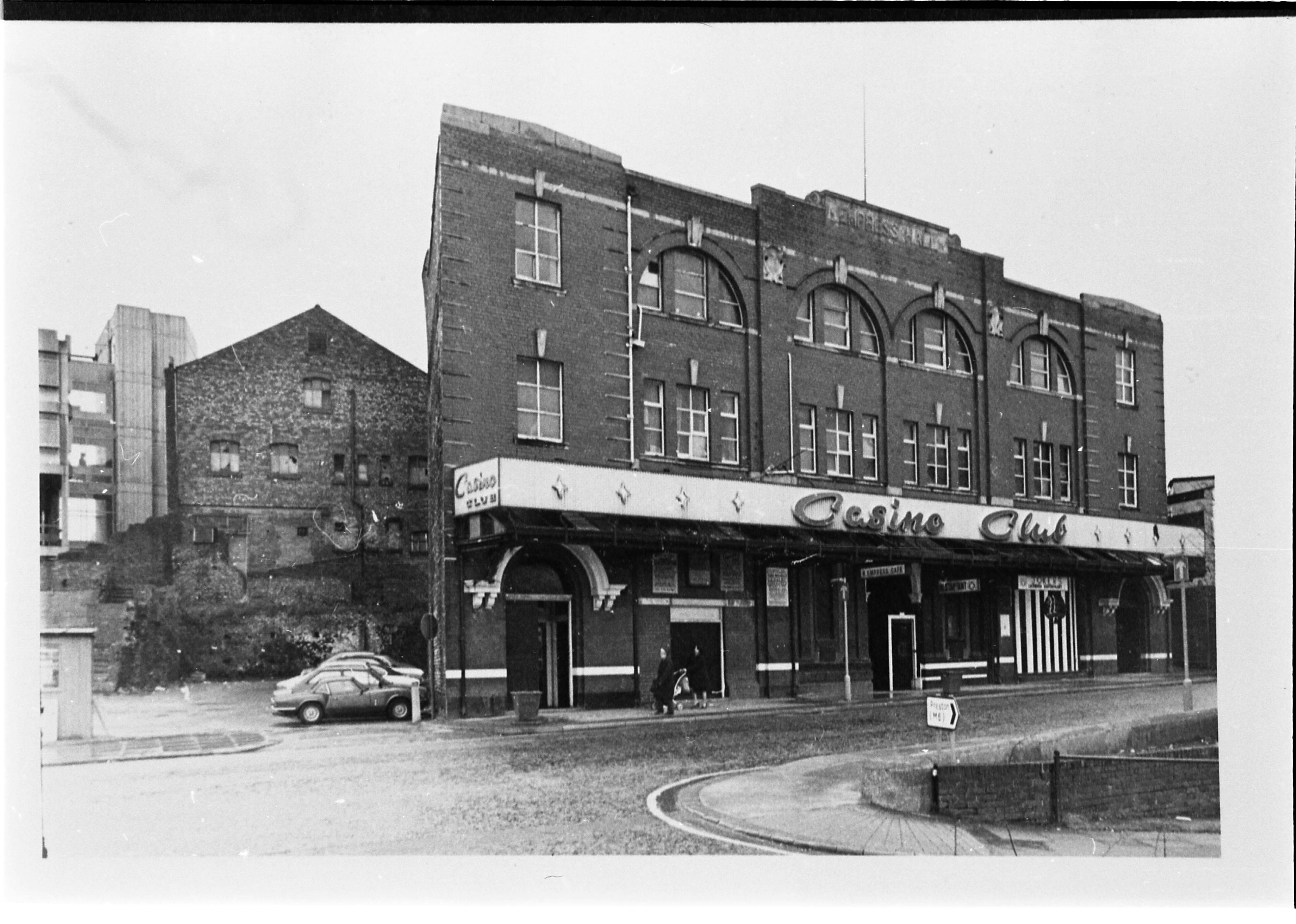 Old black and white image of an old building: 'Casino Club'