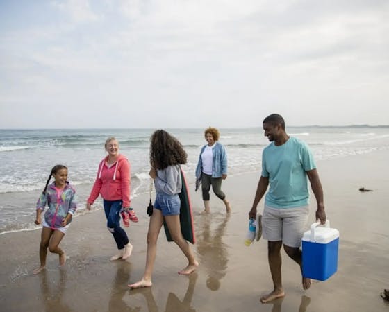 Image of a family walking on the beach