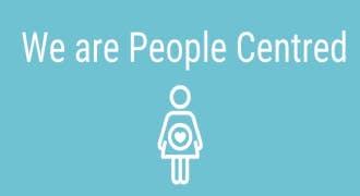 image with light blue background with icon of a heart within a person with text "We are People Centred"